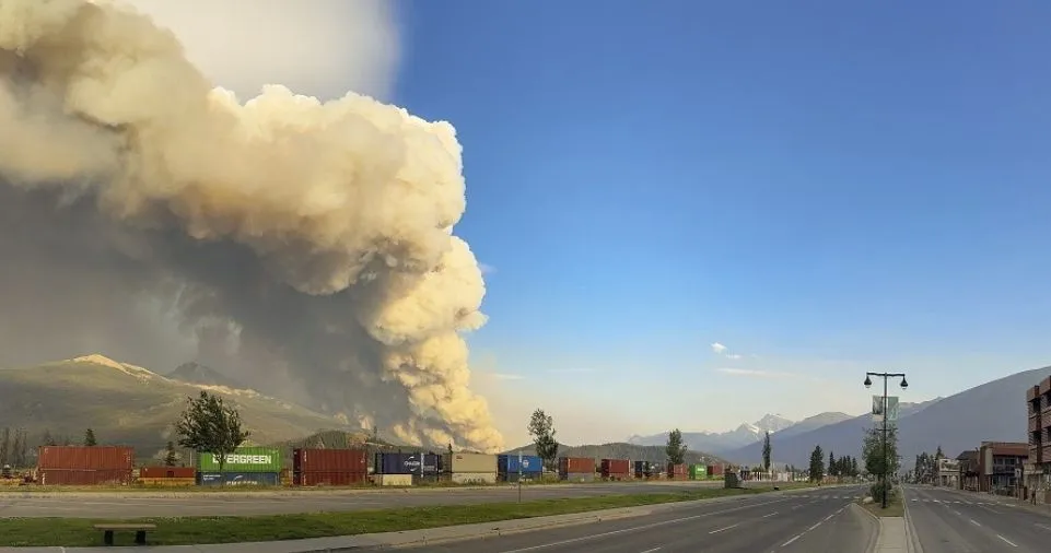 In the Canadian Rockies, a fast-moving wildfire ravages the resort town of Jasper